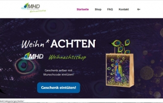 Startseite des MHD-Weihnachtsshops mit Geschenkbeutel und Schriftzug "Weihn*ACHTEN"
